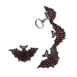 A pair of ruby 'bats' earrings, attributed to Vanessa Pederzani.