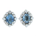 A pair of aquamarine and diamond cluster earrings.