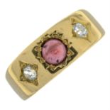 An early 20th century gold, garnet cabochon and diamond three-stone ring.