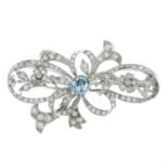 An early 20th century platinum topaz and old and single-cut diamond brooch.