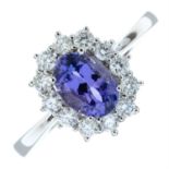 An 18ct gold tanzanite and brilliant-cut diamond cluster ring.