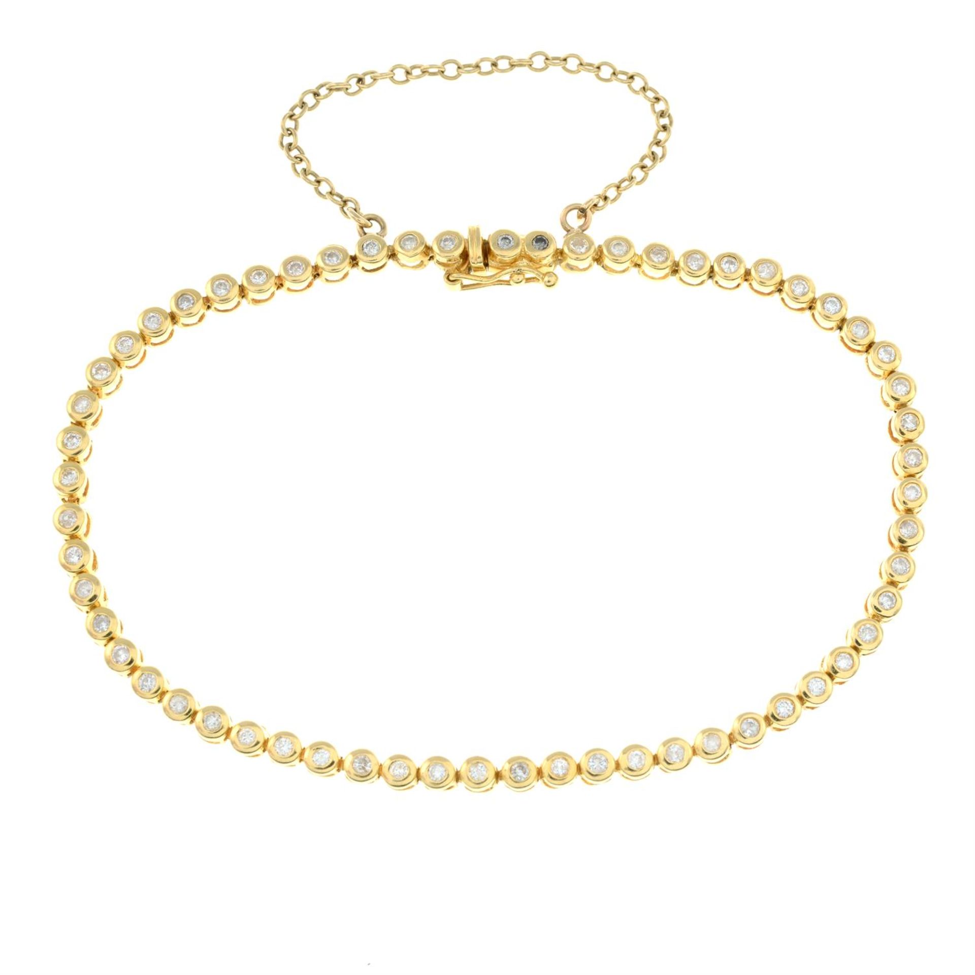 An 18ct gold diamond line bracelet.