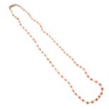 A slightly graduated cultured pearl and coral bead necklace.