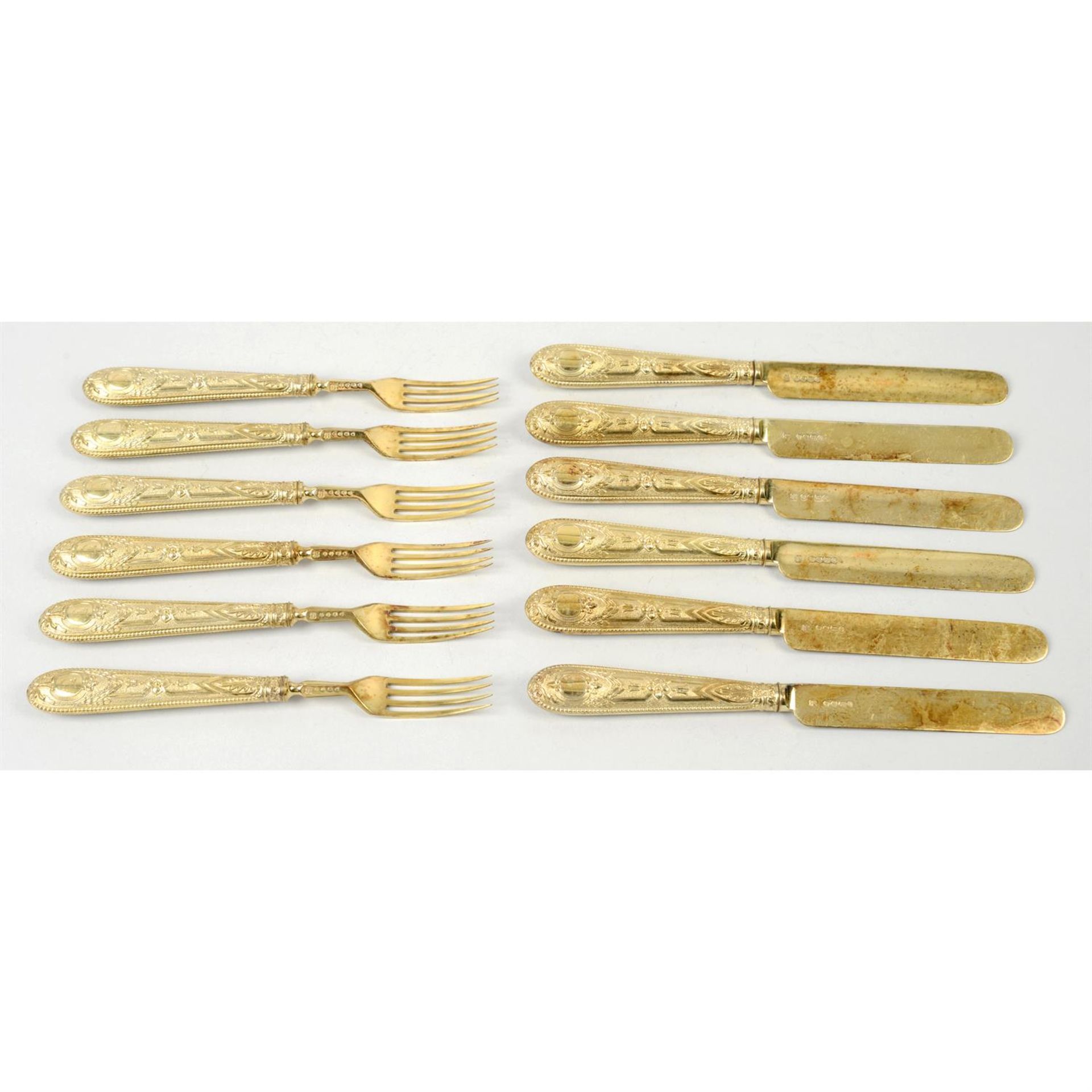 A set of Victorian silver-gilt knives & forks (22).