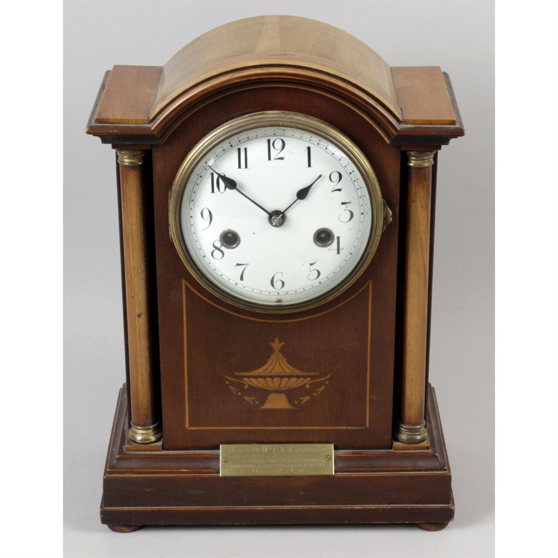 An early 20th century inlaid mahogany cased mantel clock.