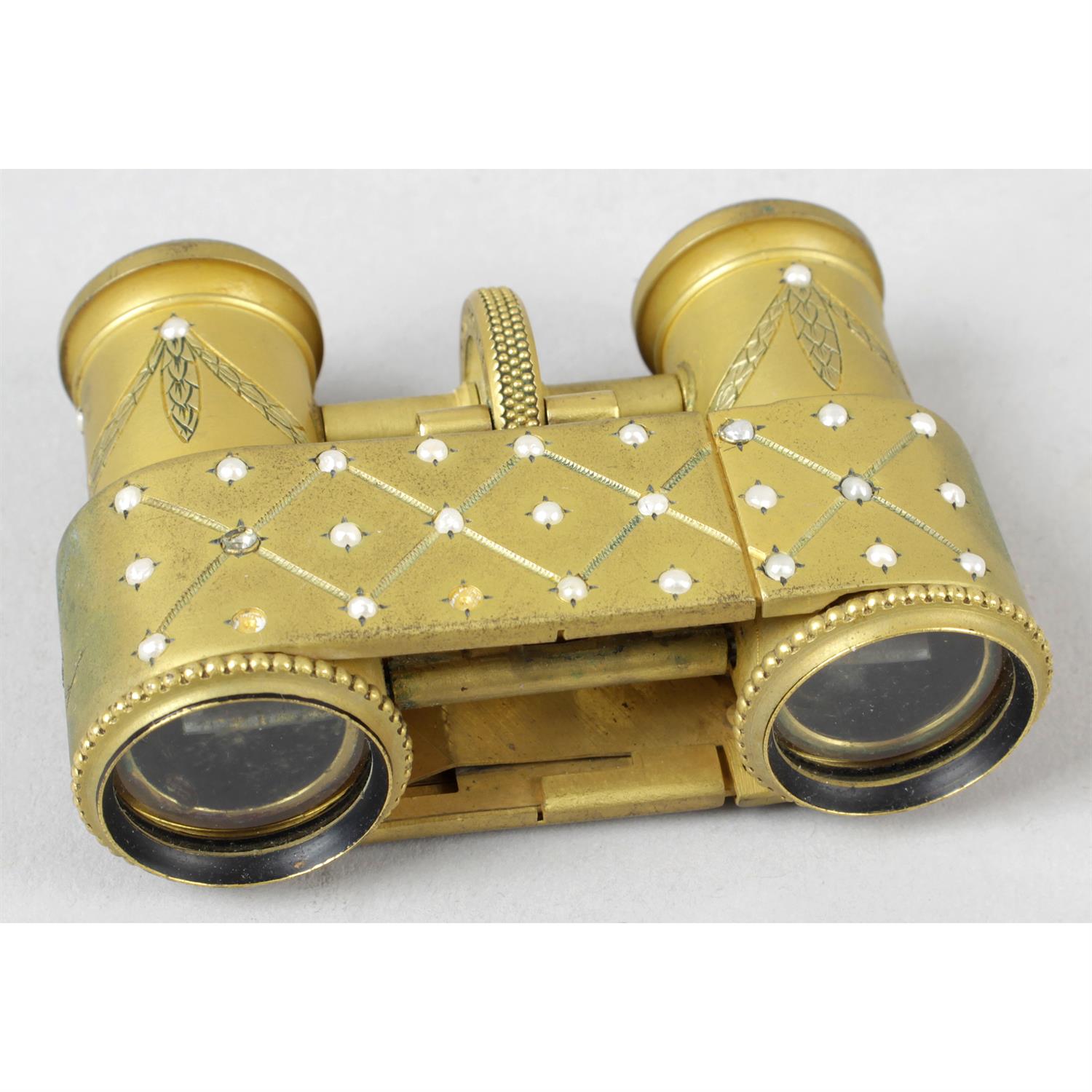 A pair of early 20th century pocket opera glasses.