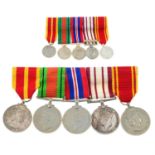 A group of five WWII and later medals, plus miniatures, etc.