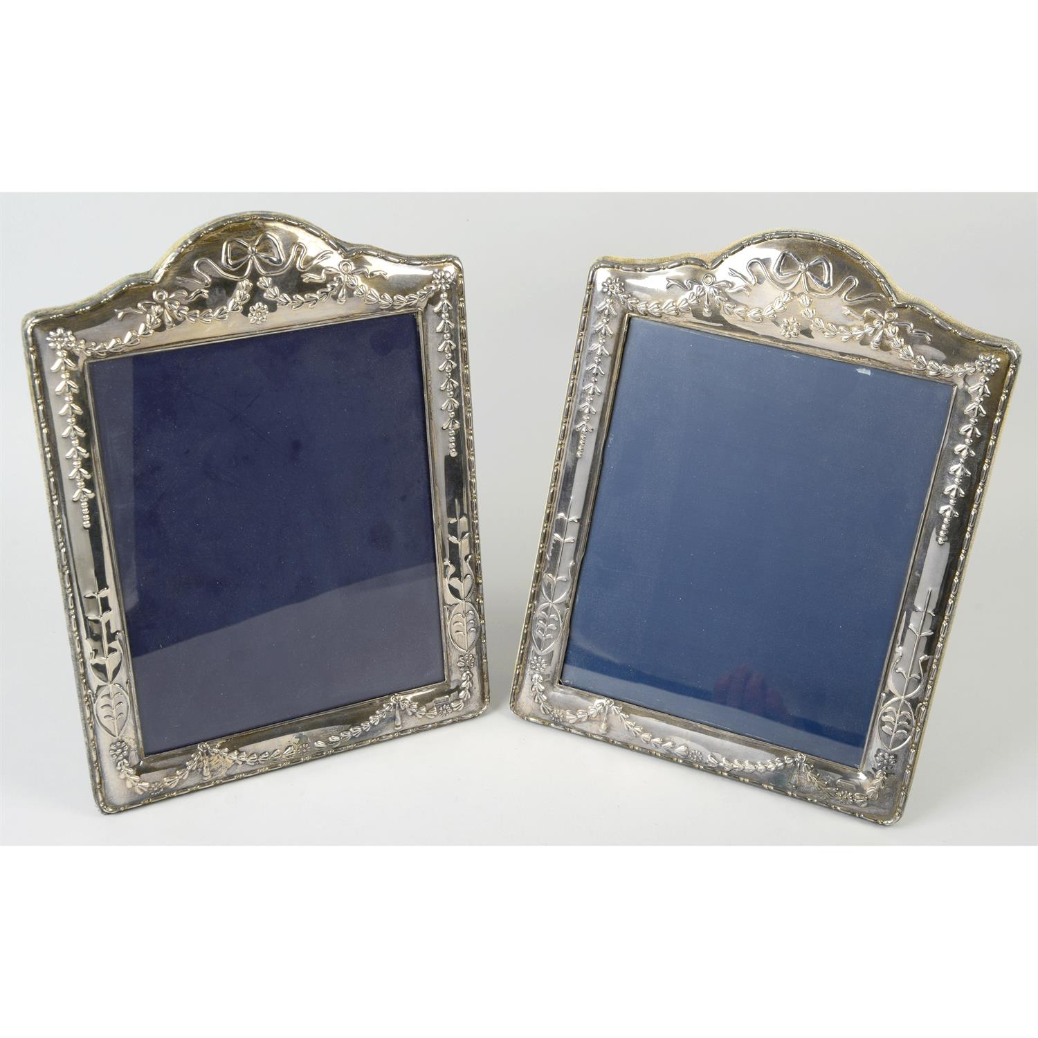 A pair of modern silver mounted photograph frames.