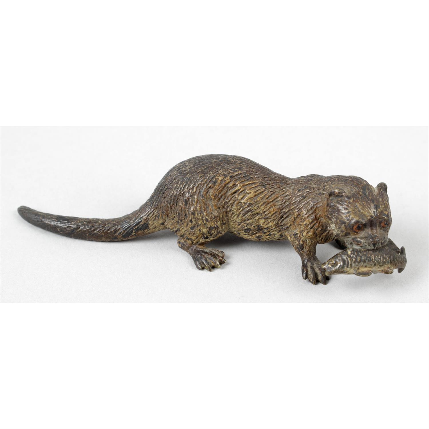 A small cold painted bronze figure, modelled as an otter.