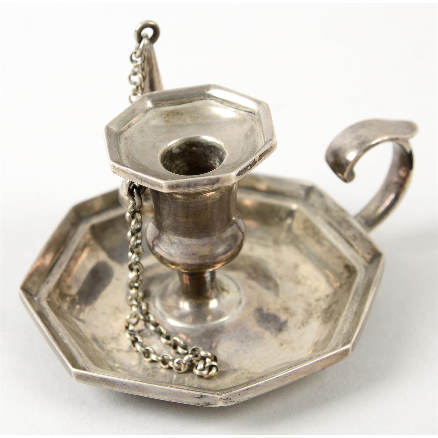 An early Victorian silver small chamberstick, with conical extinguisher.