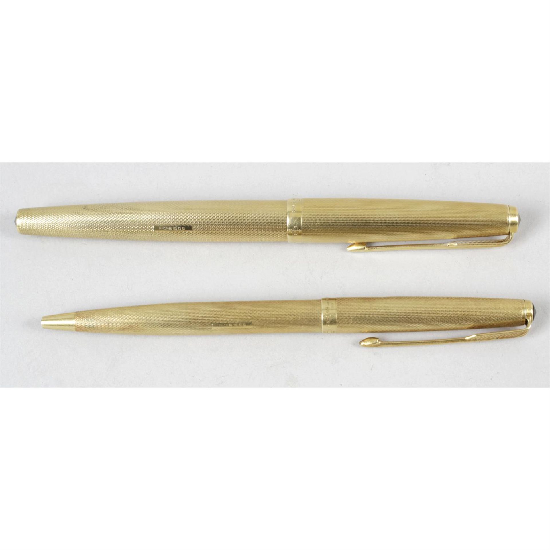 Two 18 carat gold Parker pens.