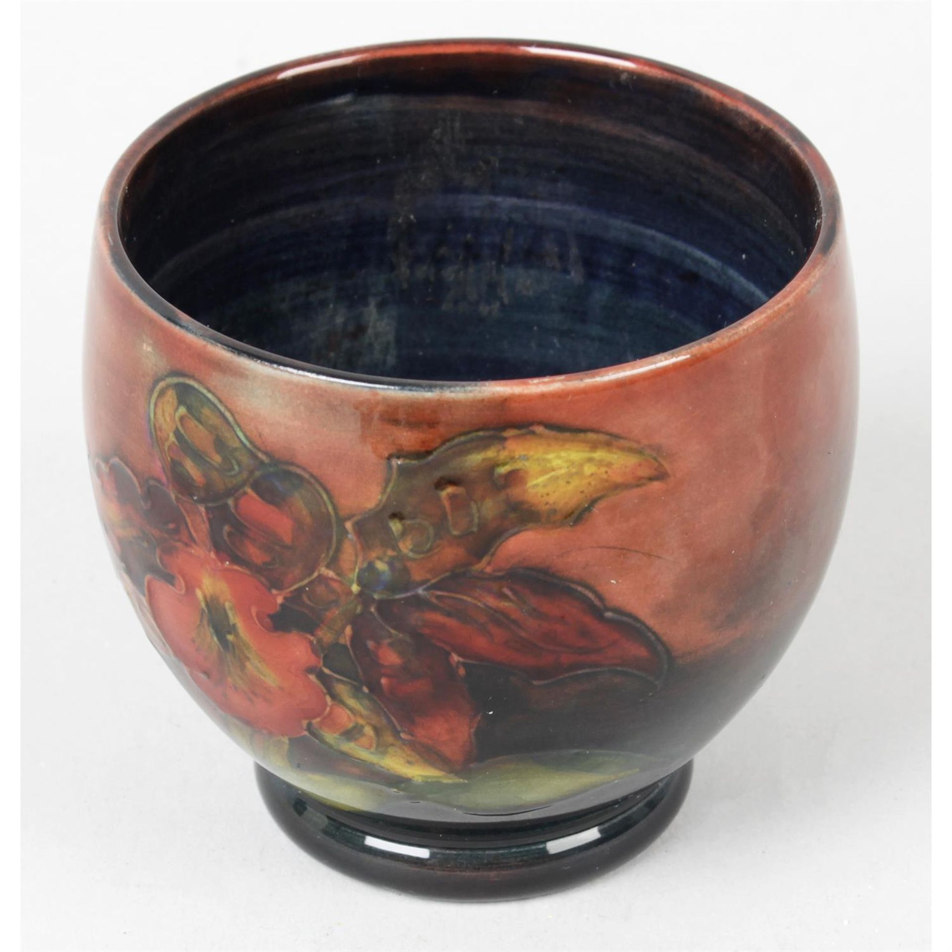 A small Moorcroft pottery pot.