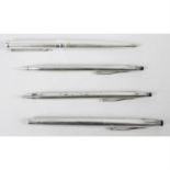 An Icon Pen Co silver cased propelling pen, together with two similar examples and a silver mounted