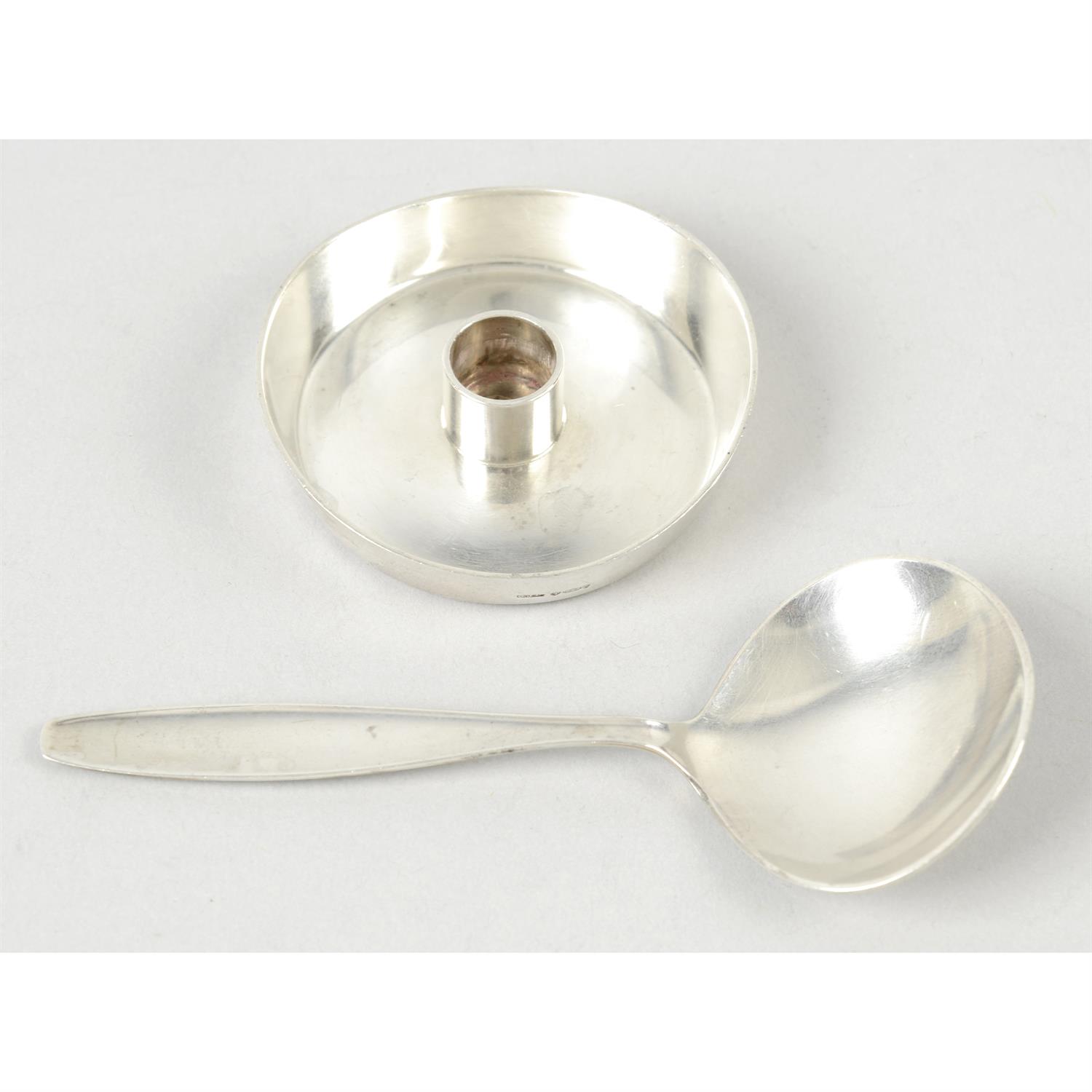 A Georg Jensen small candle holder, no. 1061; together with a Georg Jensen spoon. (2).