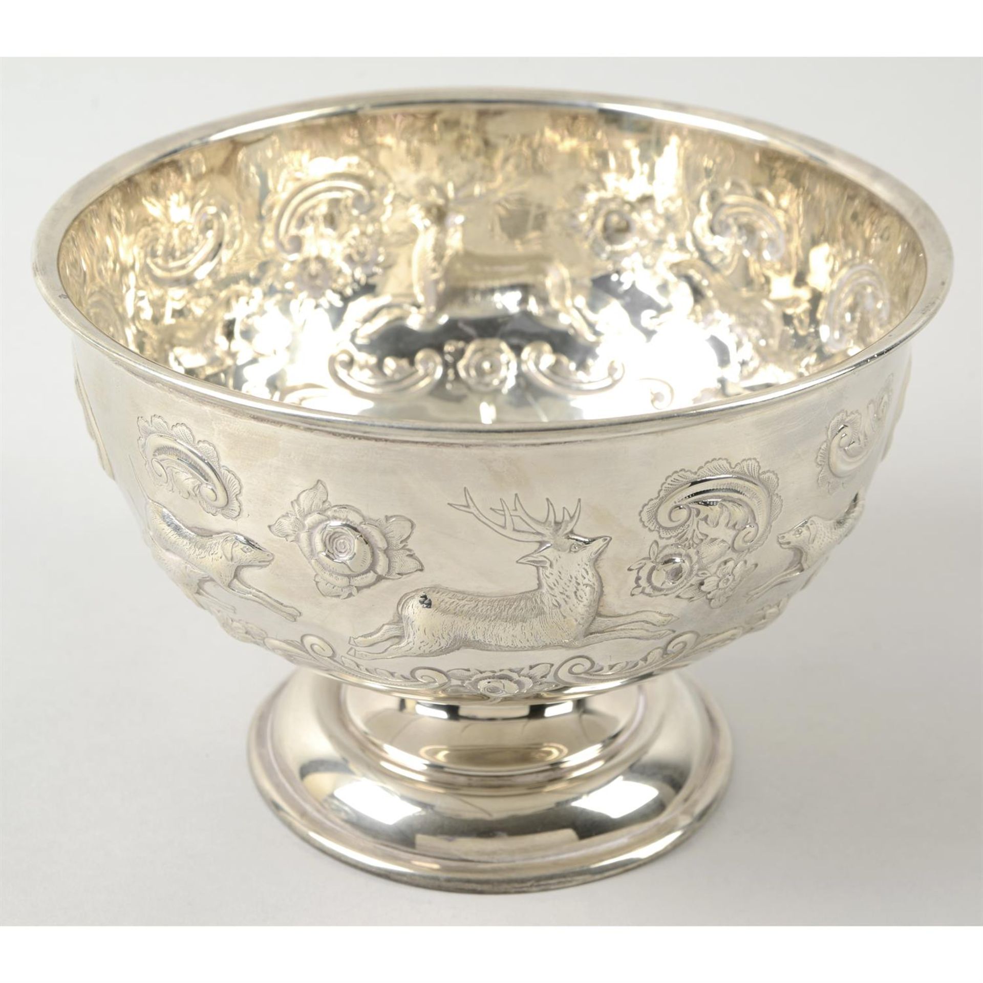 An Edwardian silver embossed pedestal bowl.