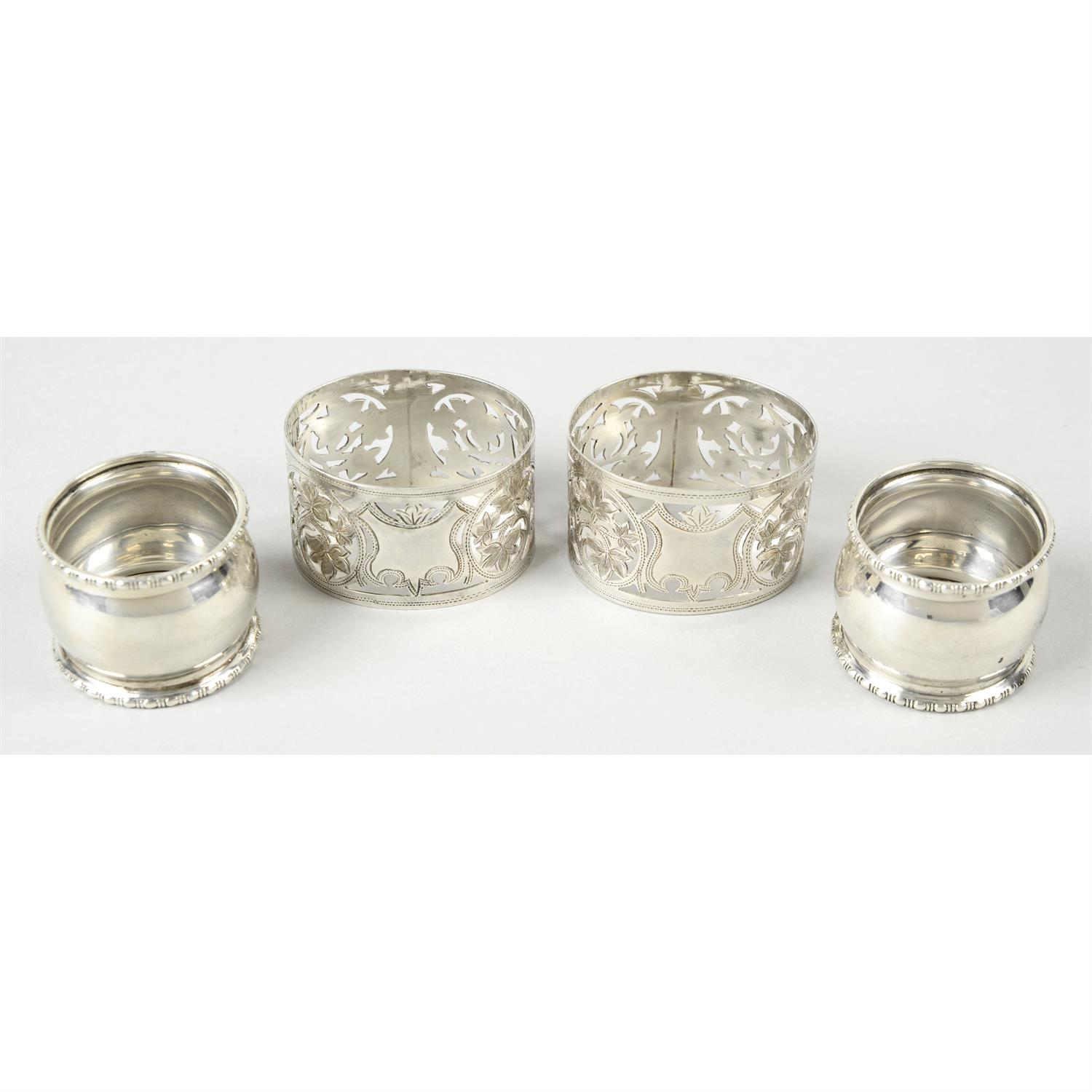 A matched set of four George V silver napkin rings by Walker & Hall; together with a pierced oval - Image 3 of 4