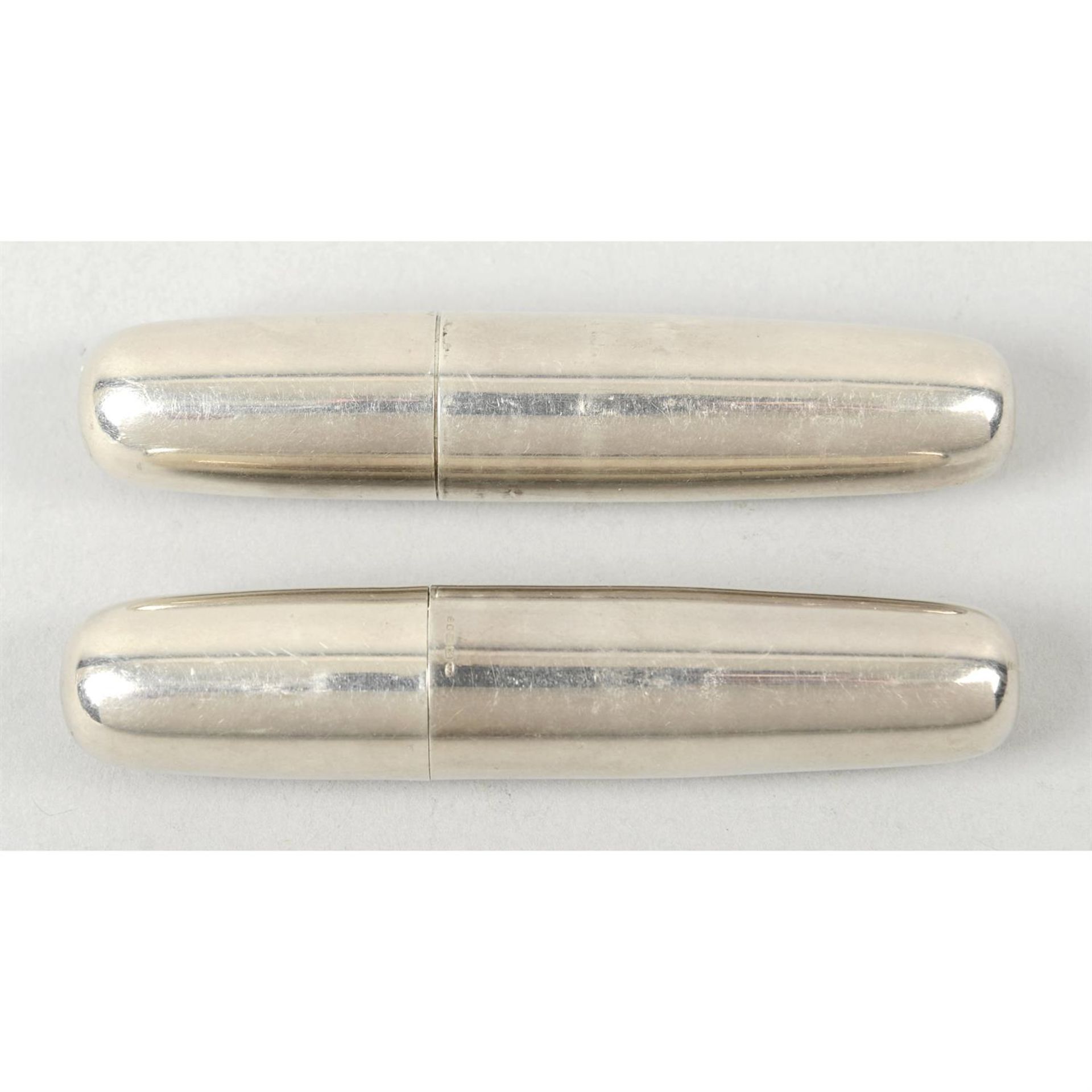A modern silver cased perfume atomiser; together with a silver cased manicure set. (2).