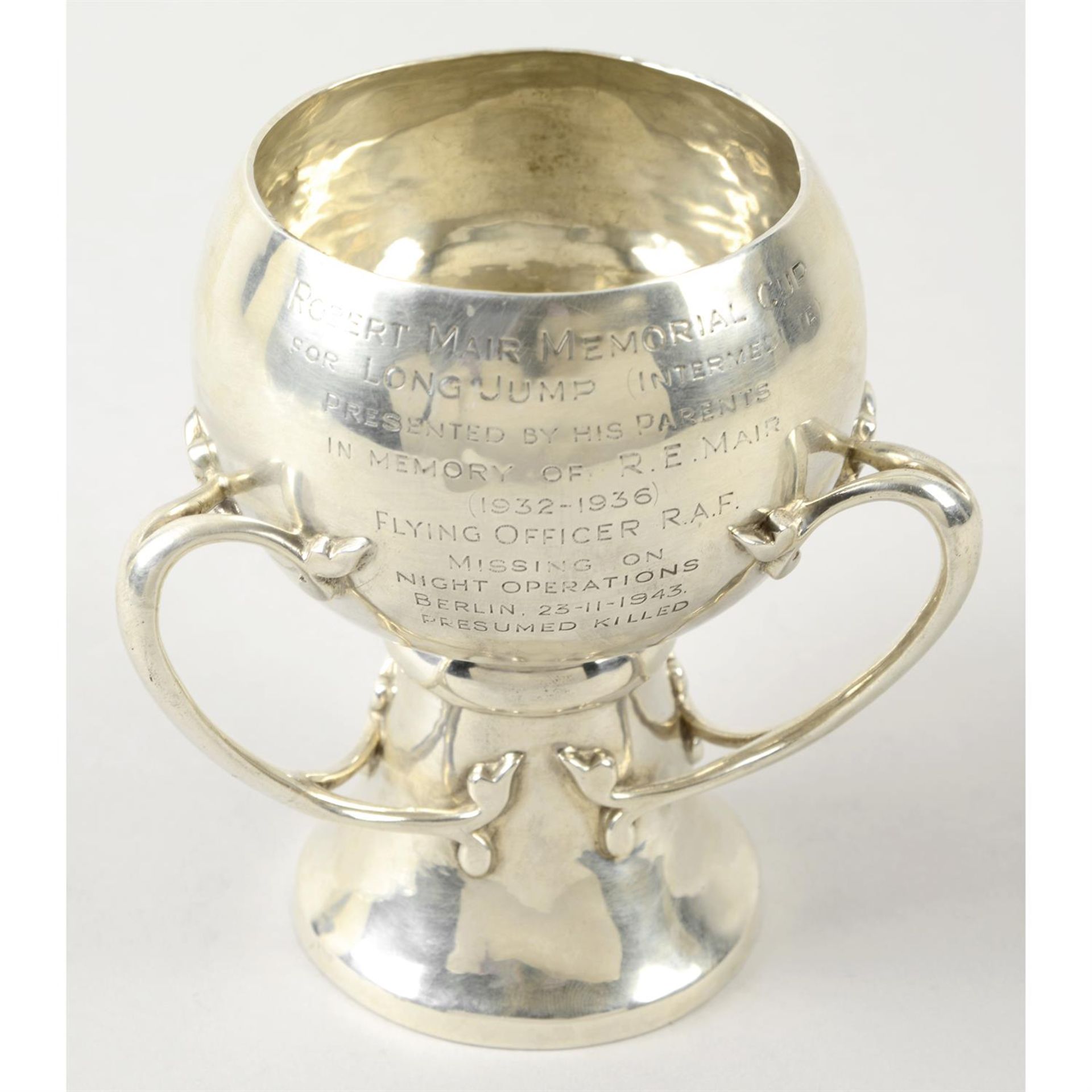A late 19th/early 20th century silver three-handled cup.