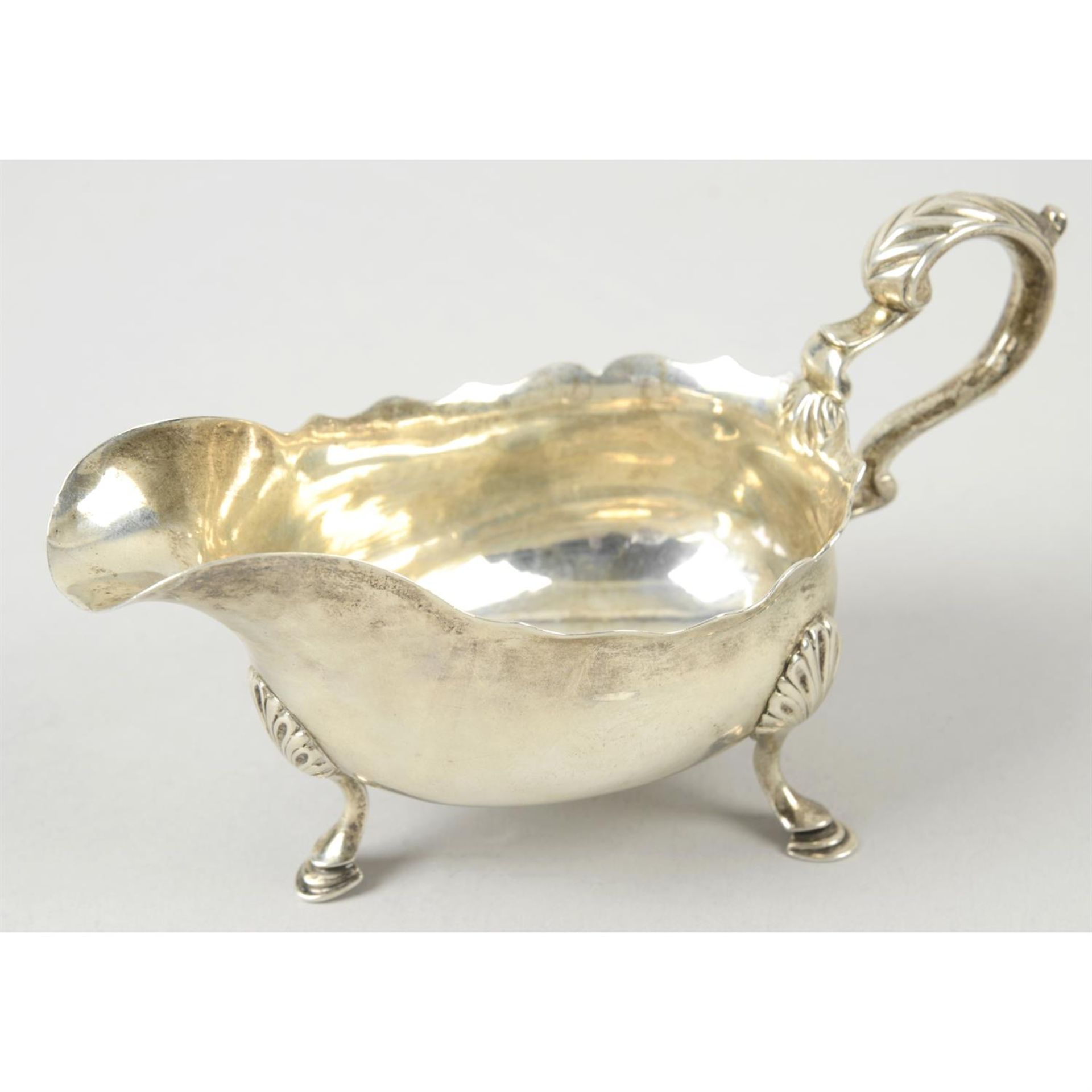 An early George III silver sauce boat.