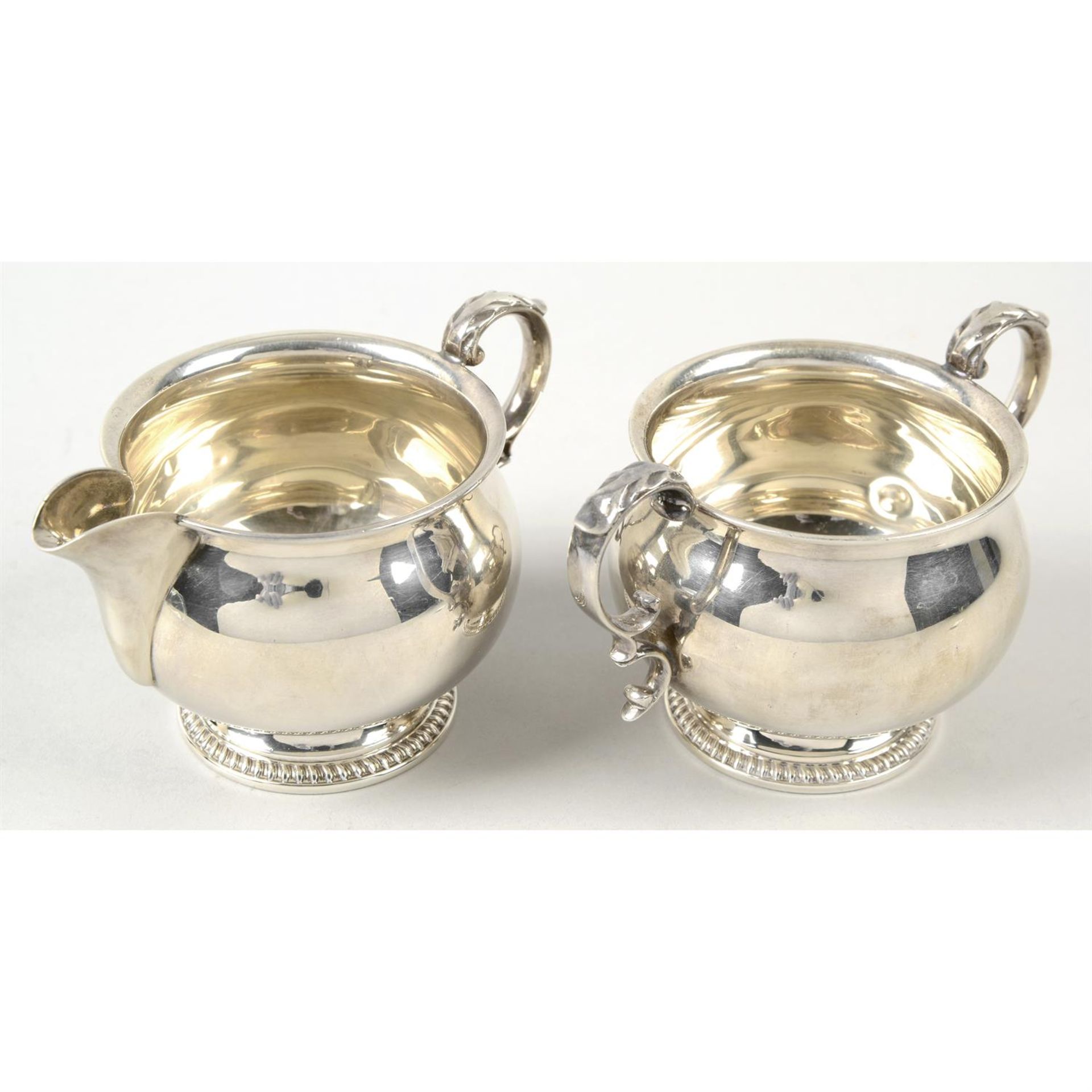 A modern silver cream jug & matching twin-handled sugar bowl. (2).