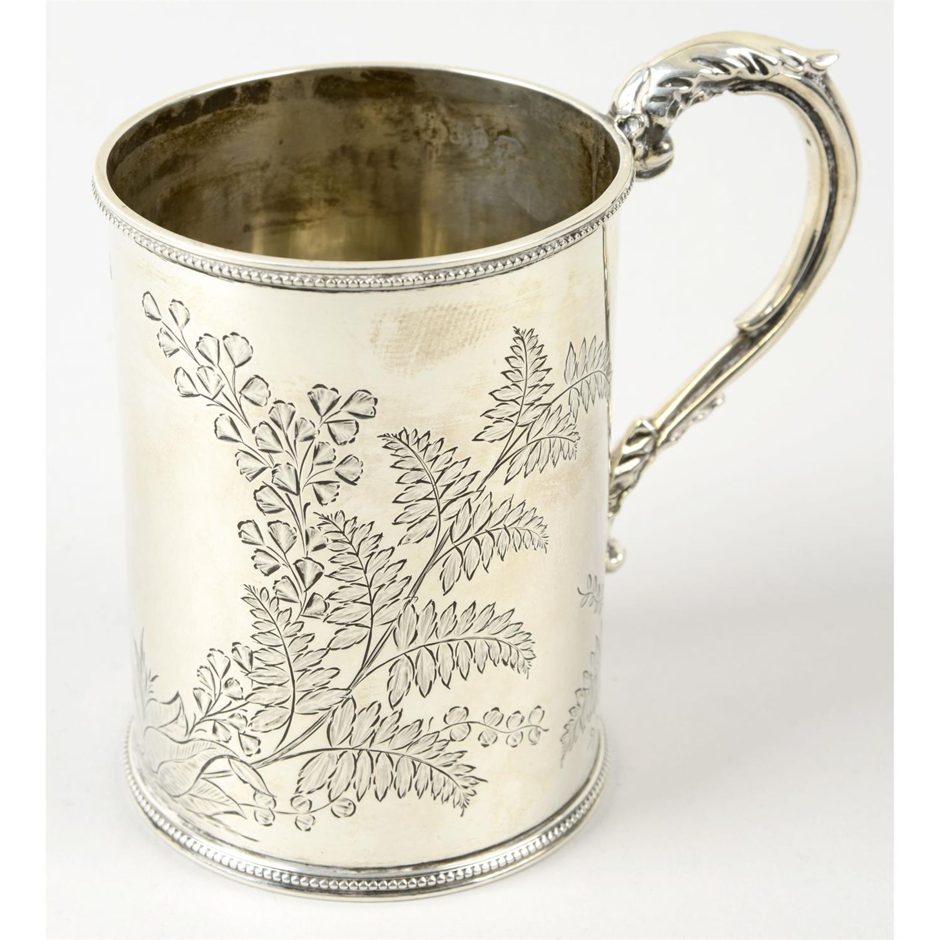 A George V silver mug.