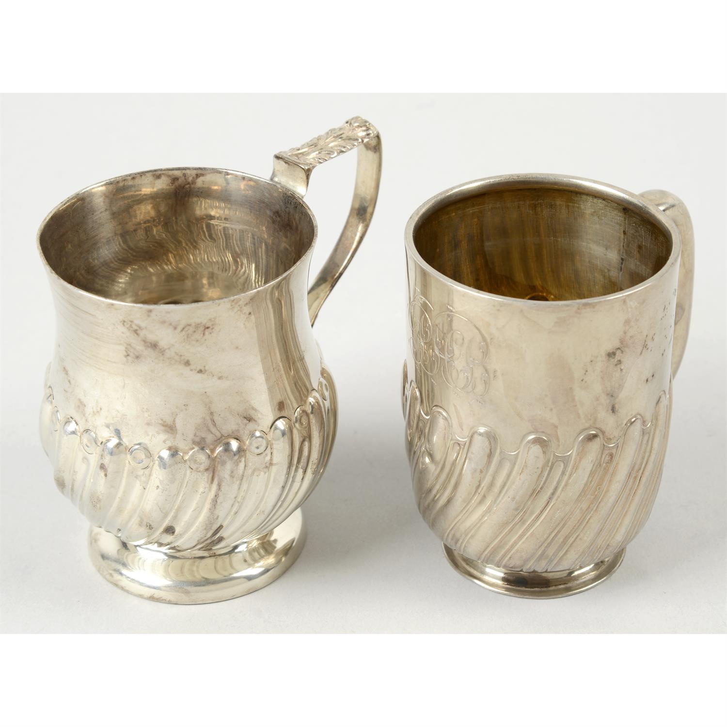 Four assorted late 19th & early 20th century silver christening mugs. (4).