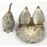 A continental condiment set, modelled as pine cones.