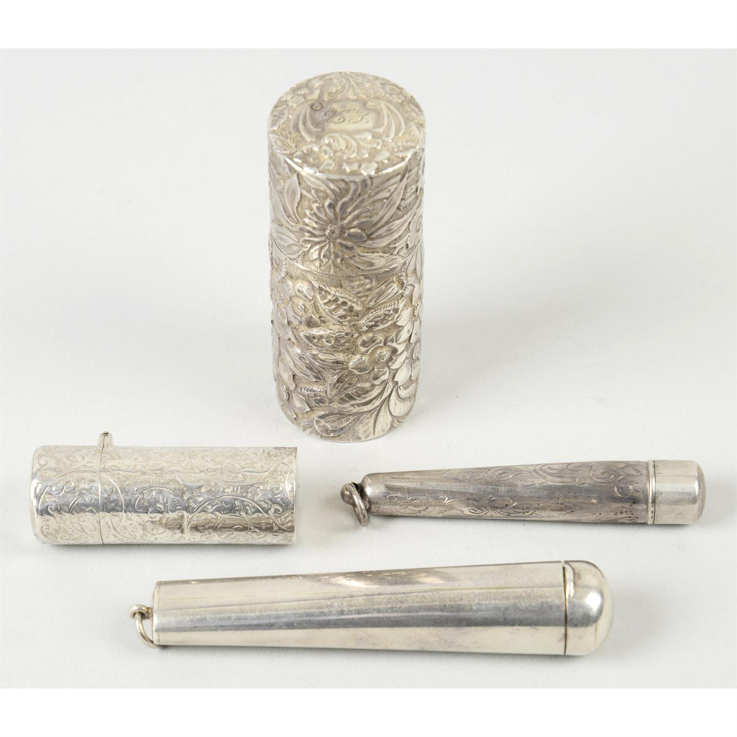 A silver mounted scent bottle, two silver cheroot cases, a mesh bag & a cylindrical case. (5).