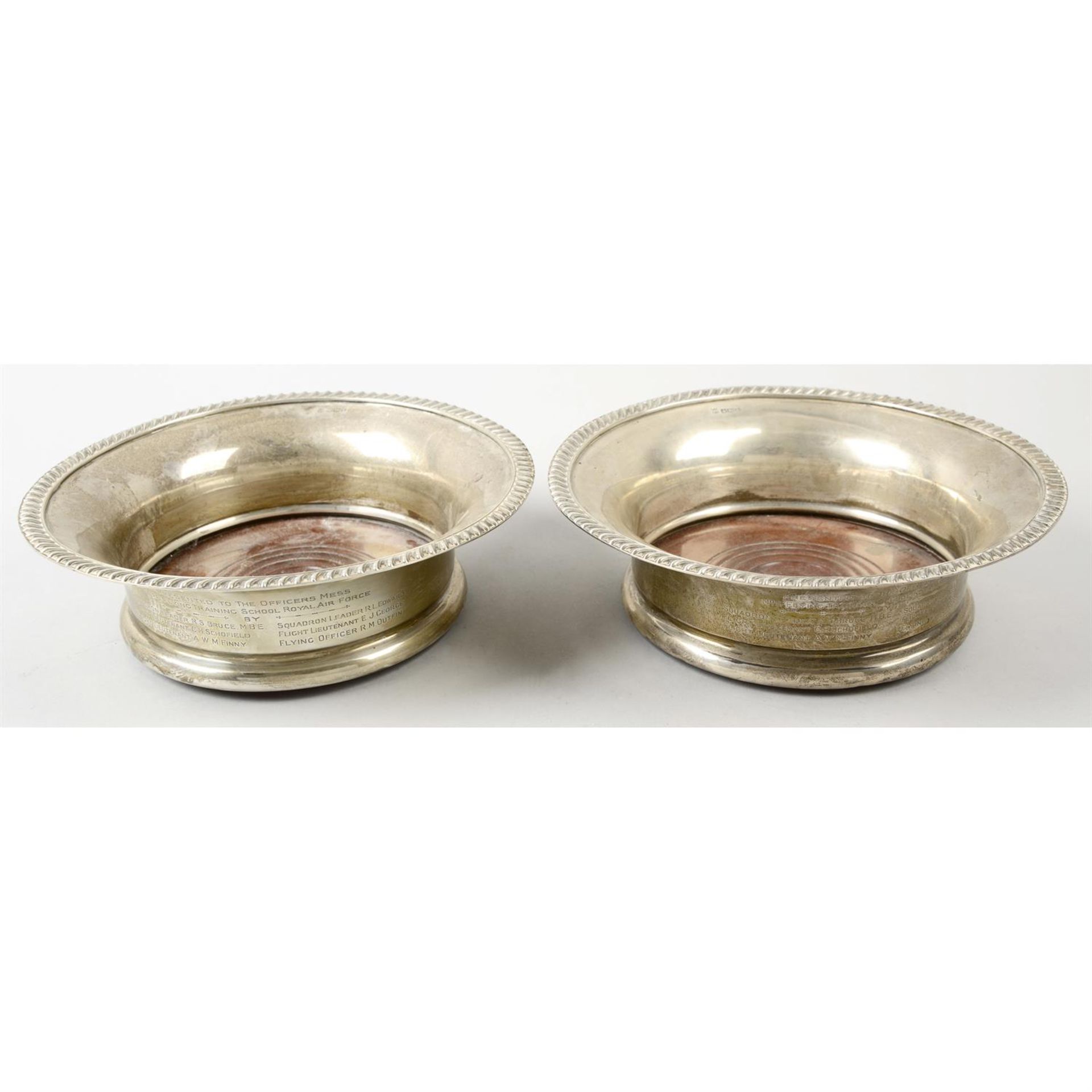 A pair of 1930's silver mounted large coasters with turned wood bases.