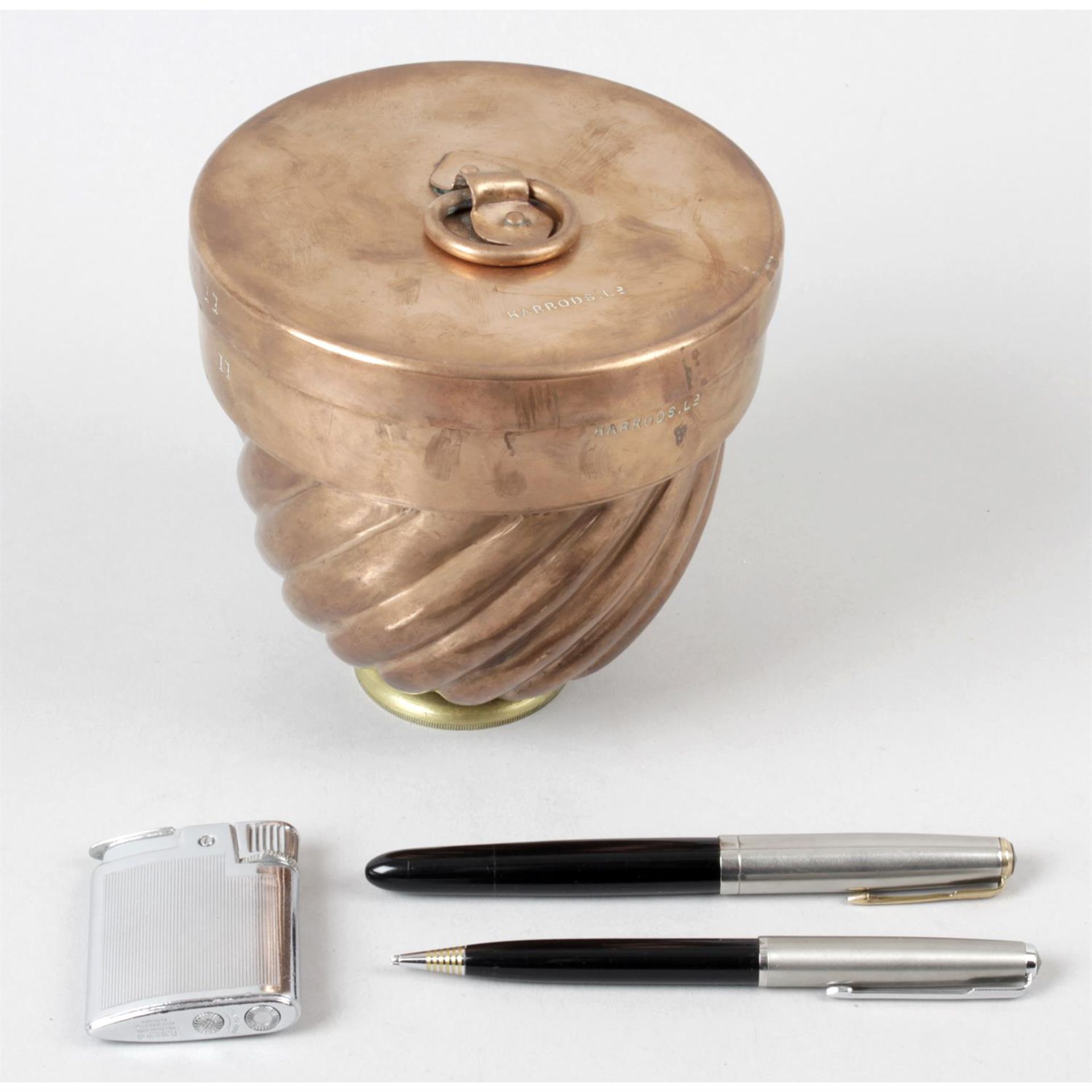 A selection of assorted items to include a copper jelly mould, together with assorted lighters and