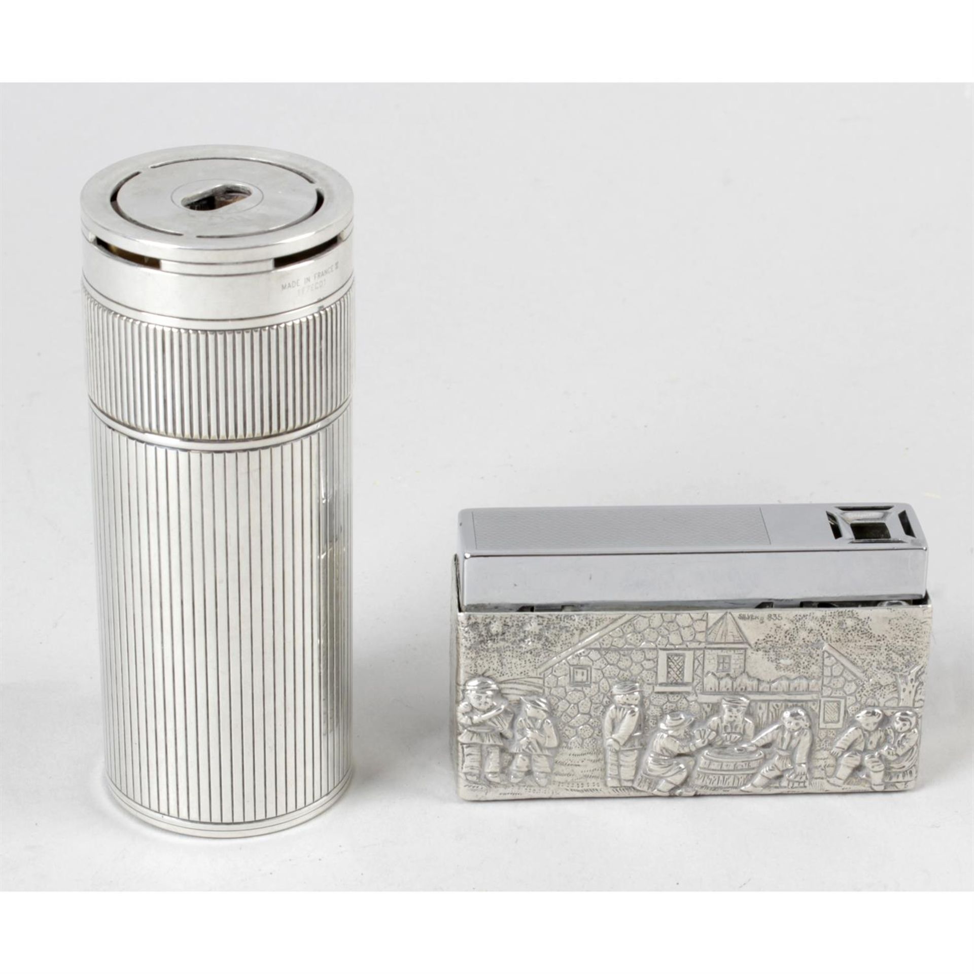 A Dupont table lighter, together with another lighter.