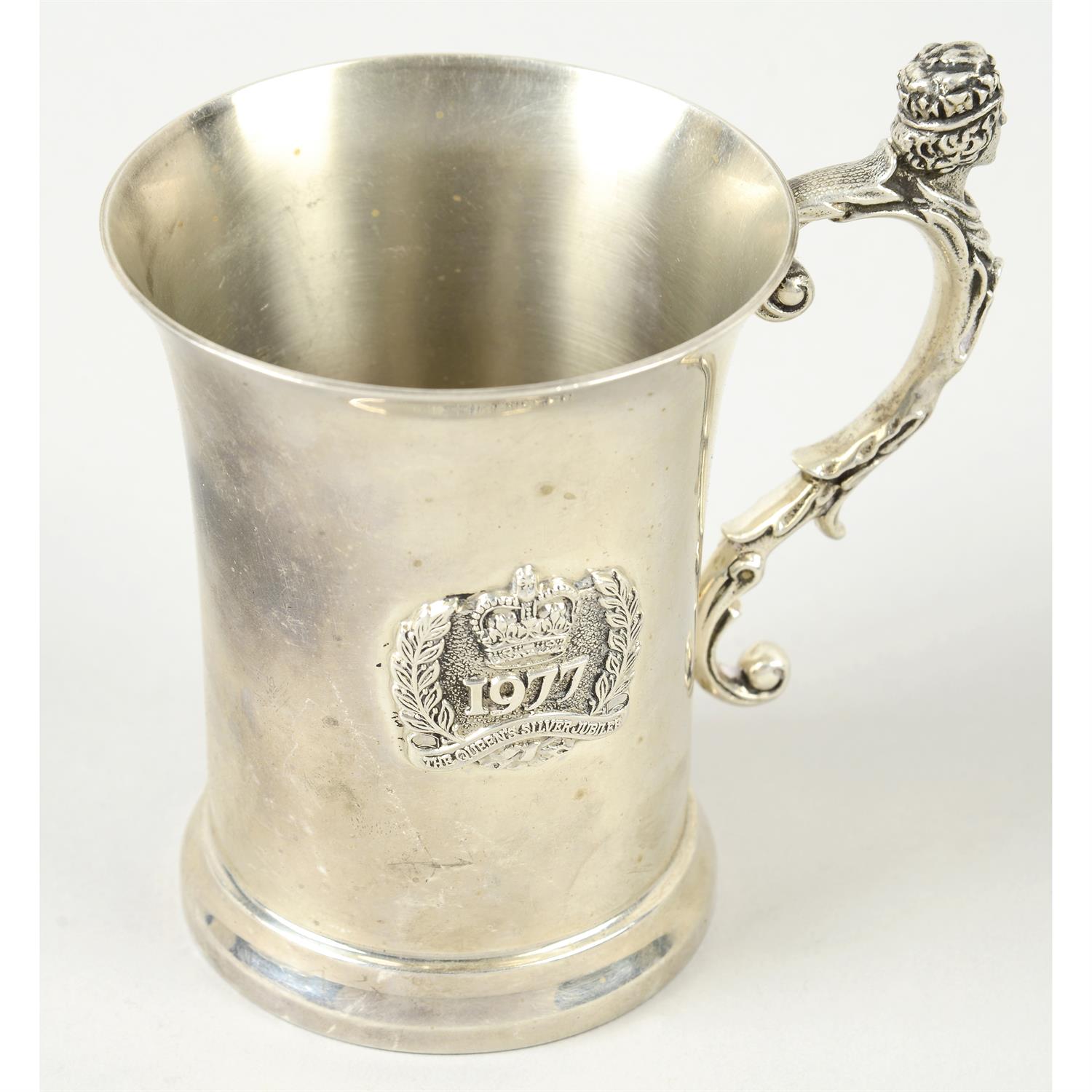 A Silver Jubilee commemorative silver mug.