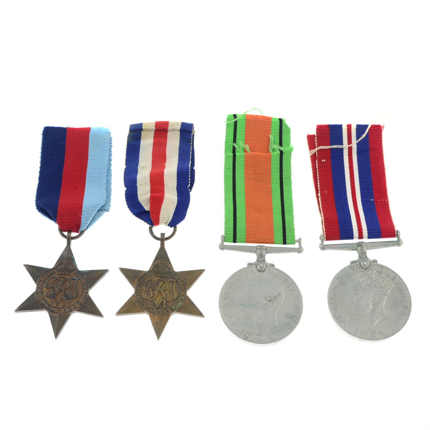 A group of four WWII medals, plus printed ephemera.