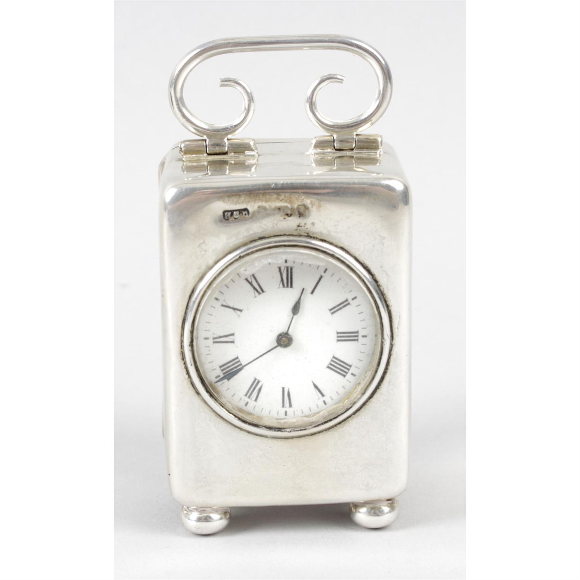 A Birmingham 1903 hallmarked silver cased carriage style travel clock.