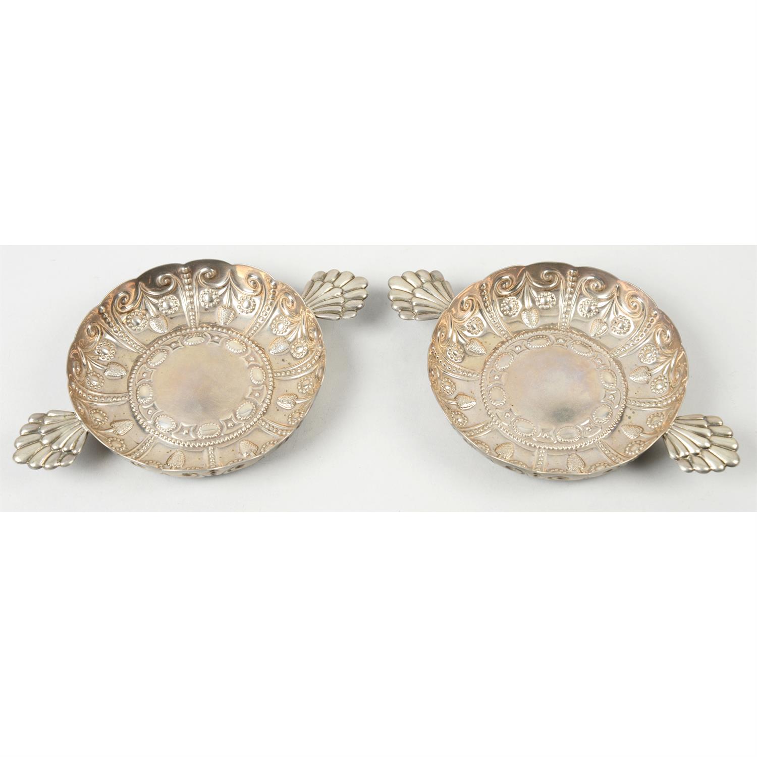 A pair of Edwardian silver twin-handled dishes.