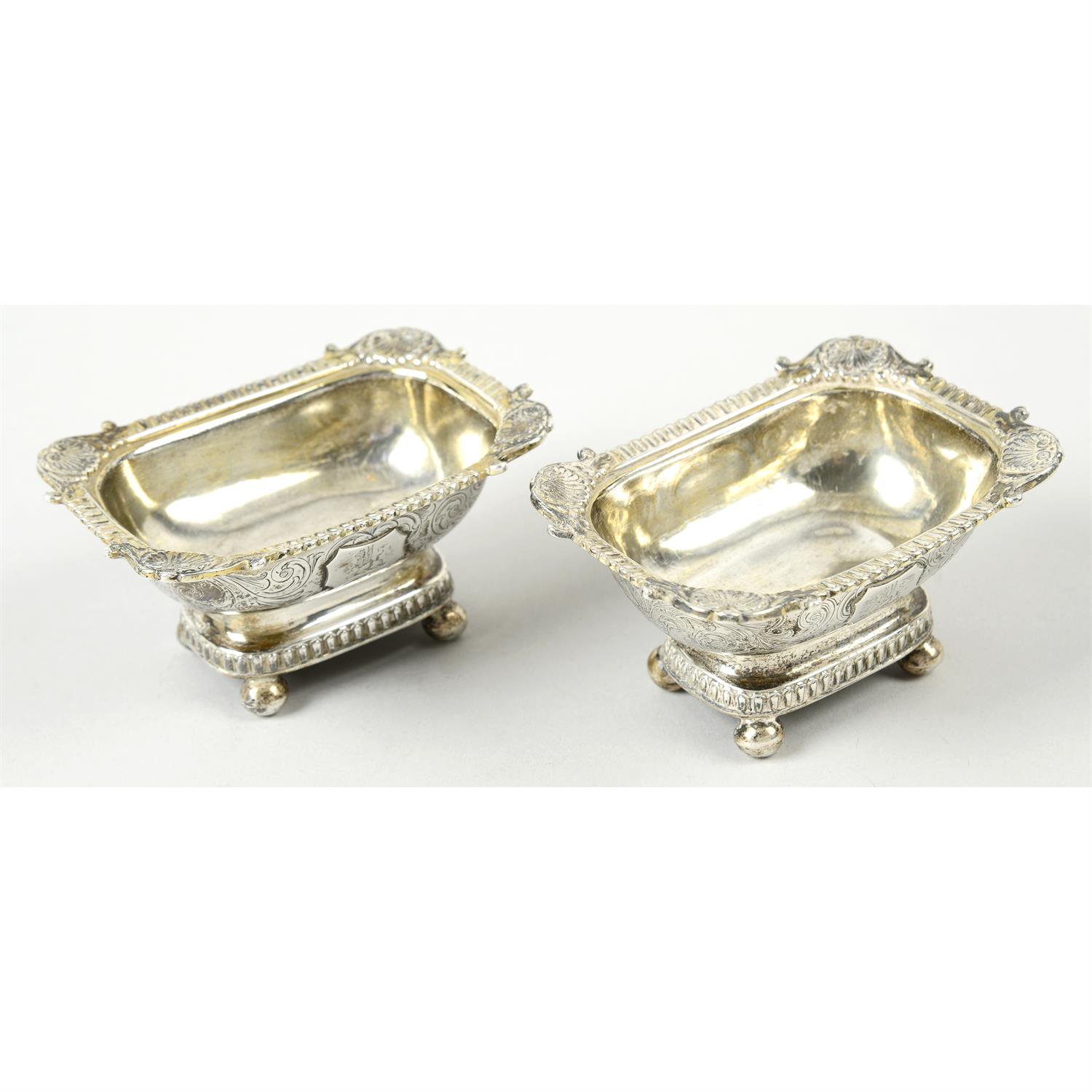 A matched pair of George III Scottish silver pedestal salts.