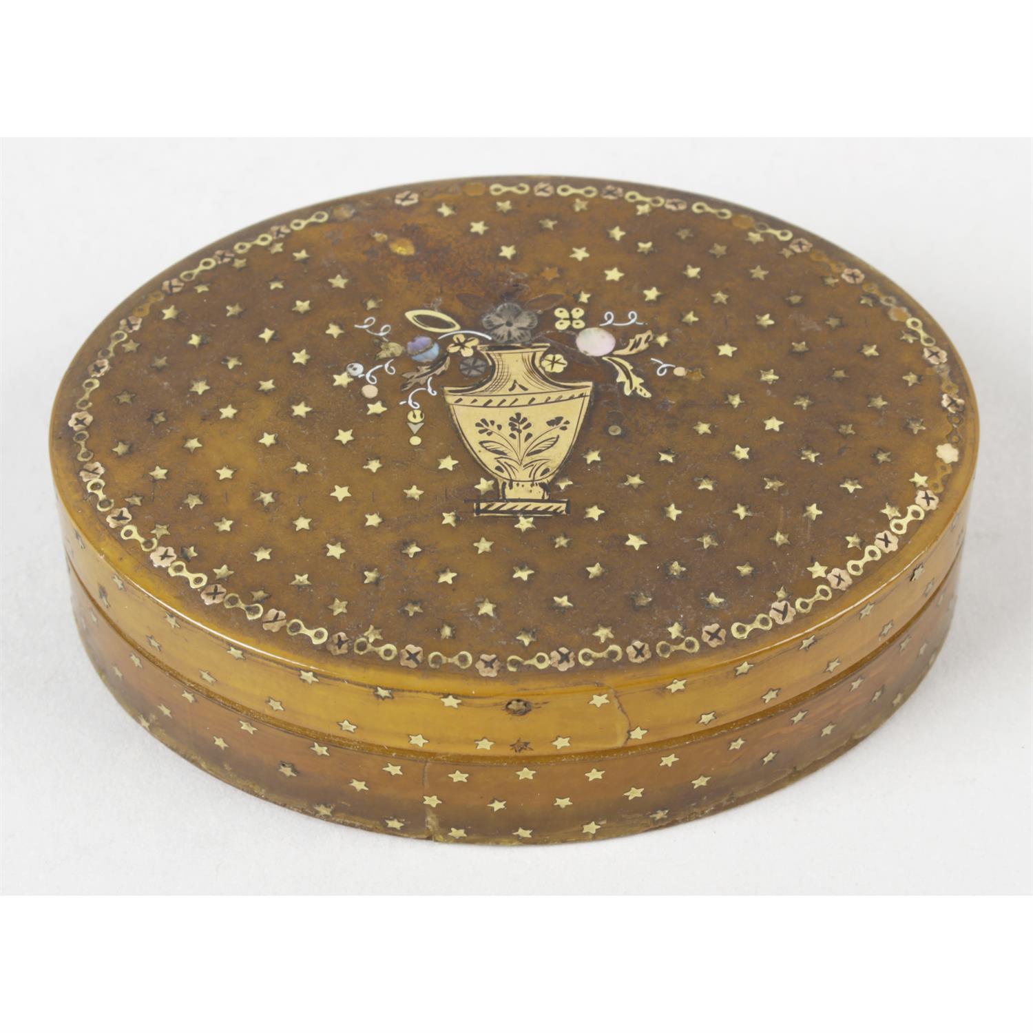 A nineteenth century horn and pique work oval snuff box and cover.