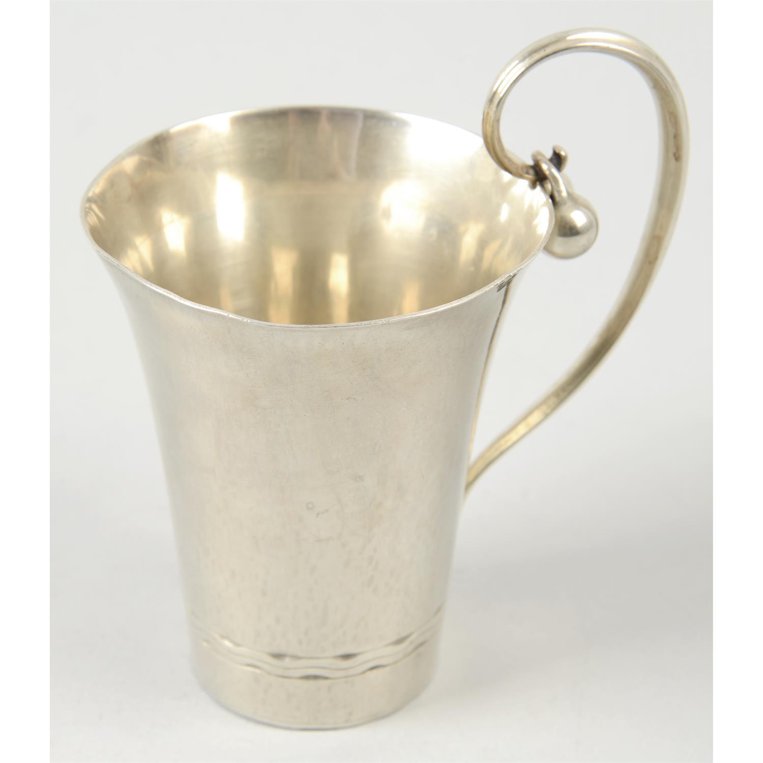 A Georg Jensen sterling silver mug.