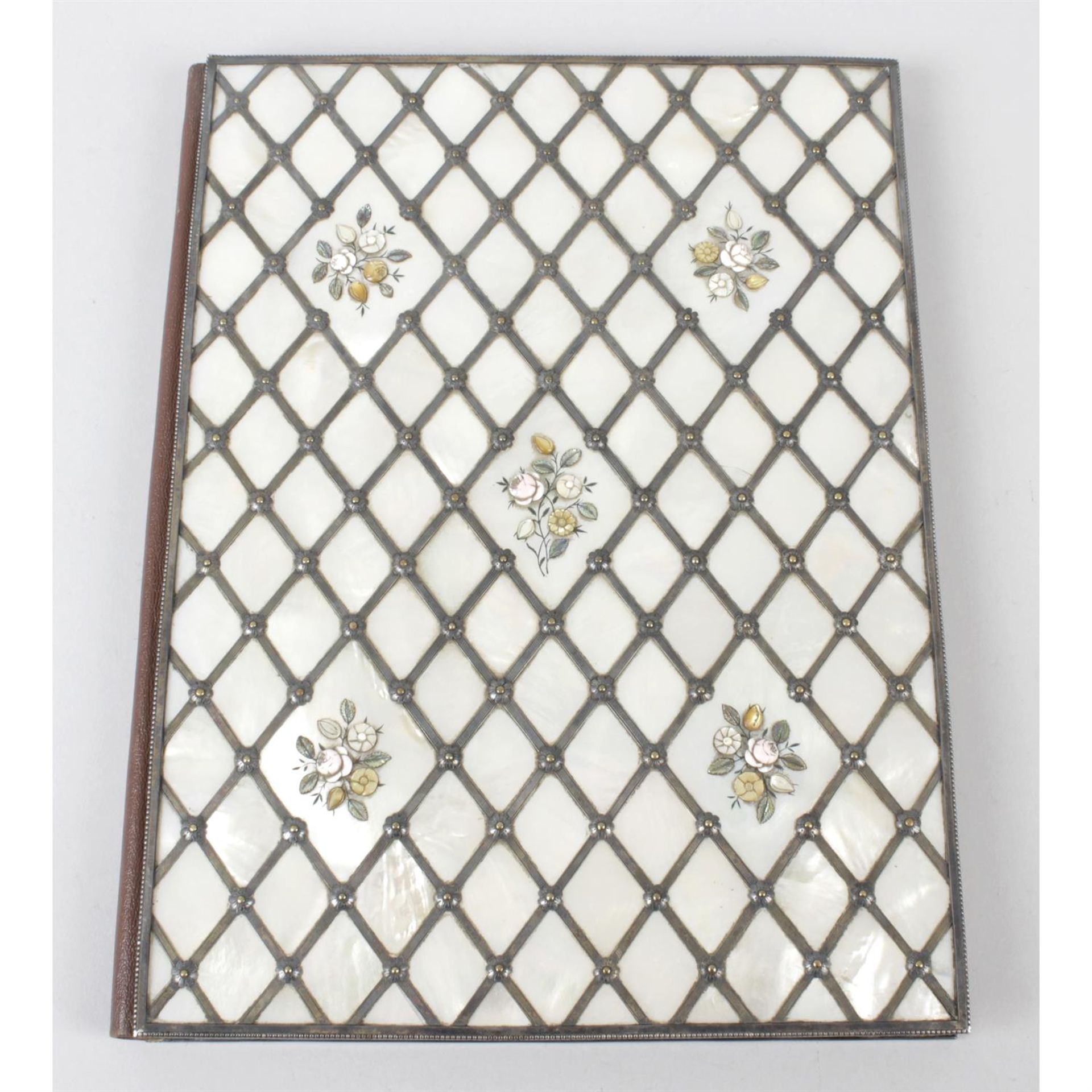 An early 20th century bound blotter with mother of pearl decoration.