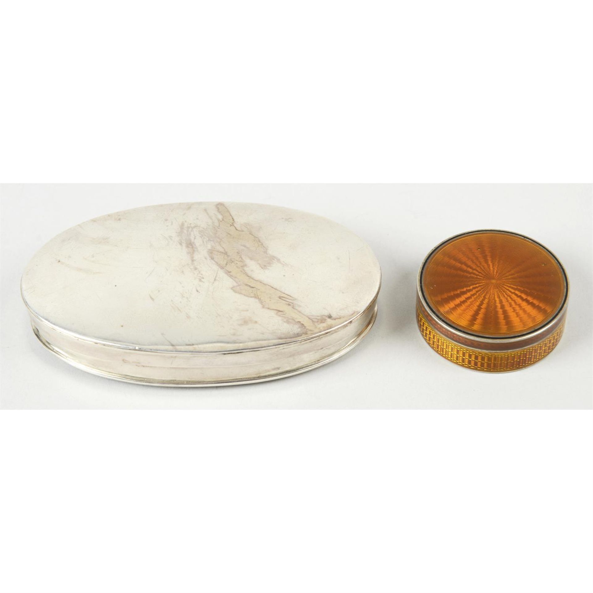 A French enamel small circular box; together with an oval powder box. (2).