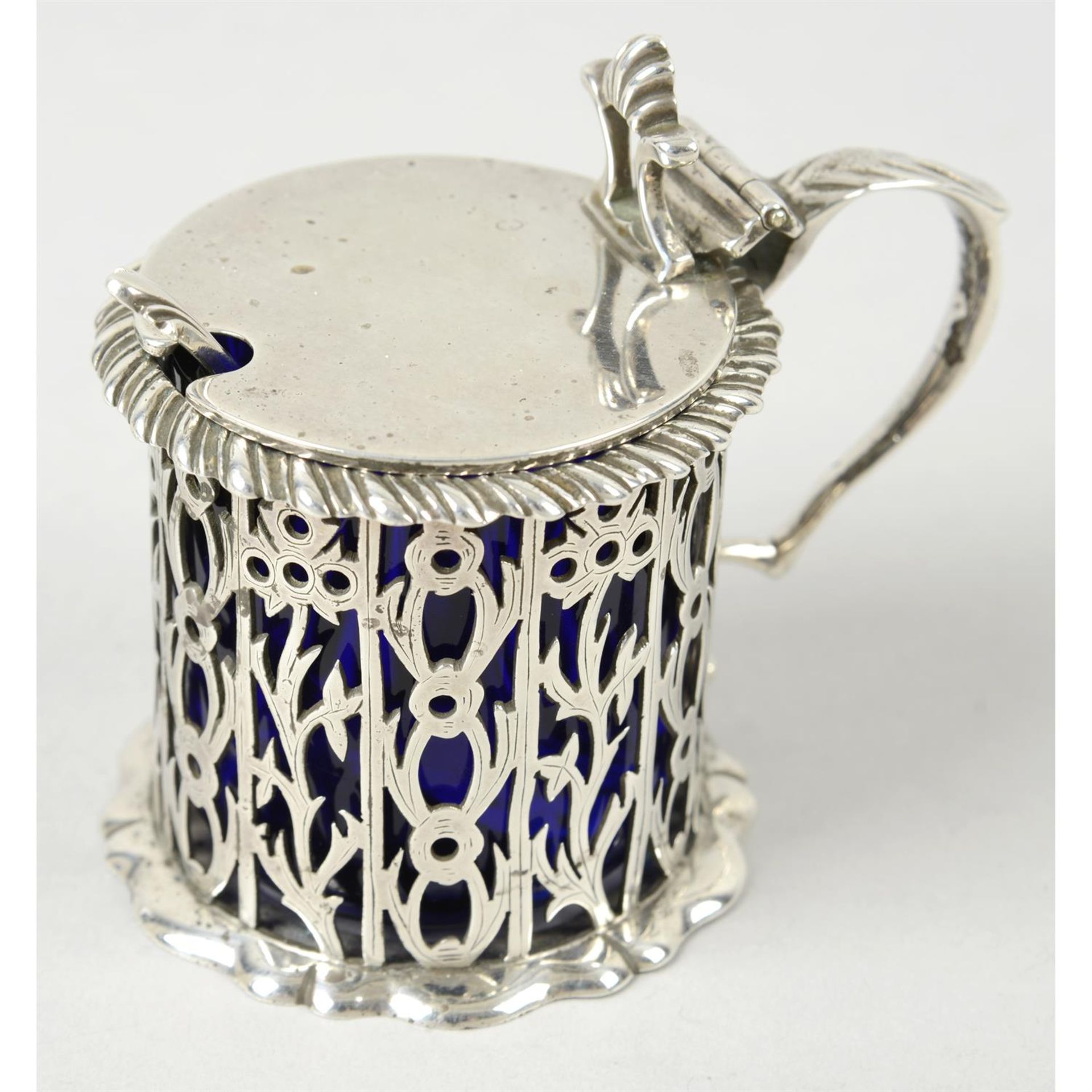 A late Victorian silver pierced mustard pot.