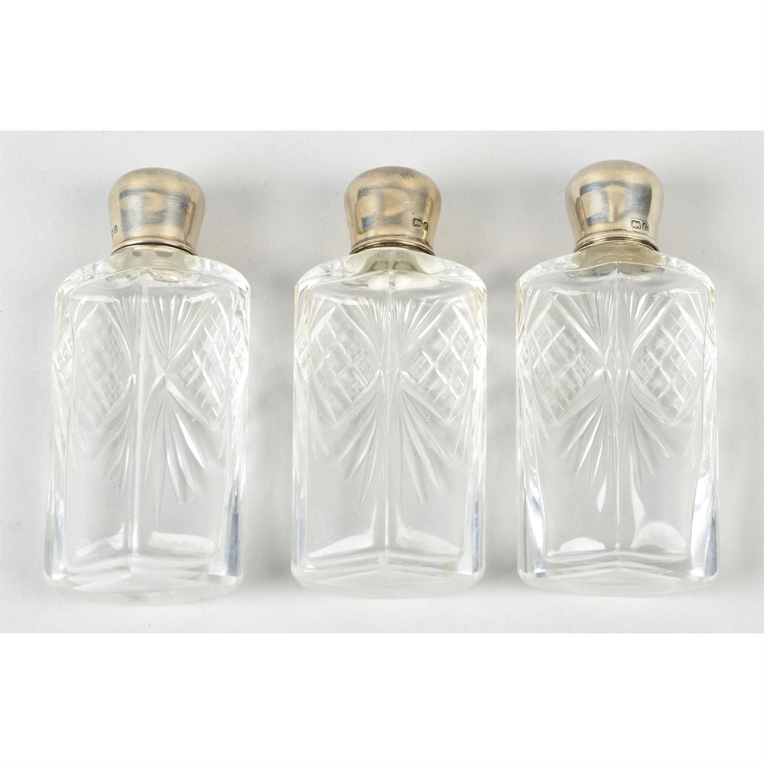 An Edwardian silver mounted three bottle perfume set. - Image 2 of 3