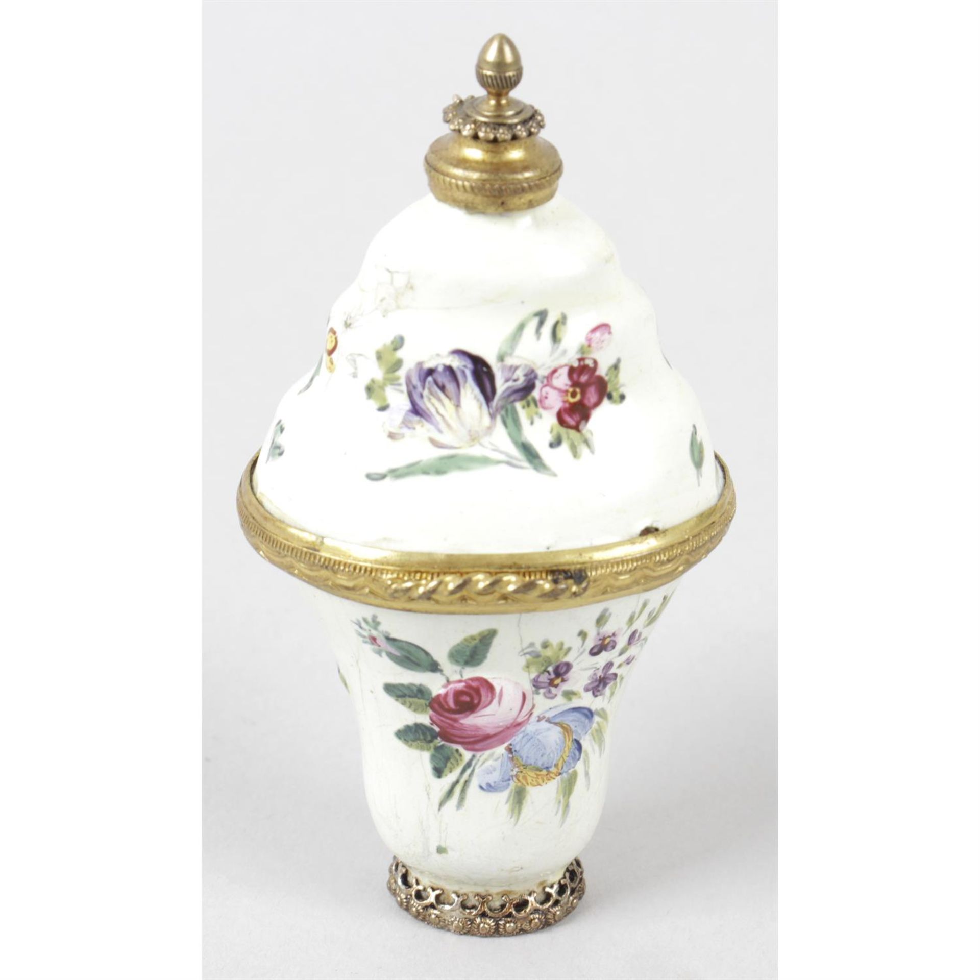 An antique enamelled ladies scent bottle and vanity case.