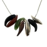 A silver onyx, nephrite and wood fish motif necklace, by Frank Gehry for Tiffany and Co.