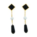 A pair of onyx and seed pearl drop earrings.