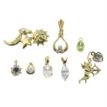 Eight gem-set charms.