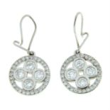 A pair of brilliant-cut diamond drop earrings.