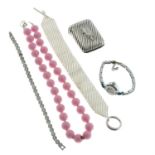 A bag containing a large quantity of assorted costume, fashion Jewellery, cutlery and other items,