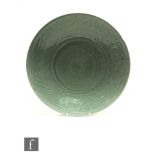 A collection of three Chinese Longquan style celadon glazed dishes, each decorated with central