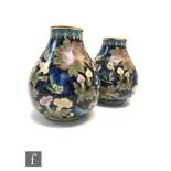 A pair of Chinese Cloisonne vases, each of pear form with ruyi upper borders, the gilt wire filled